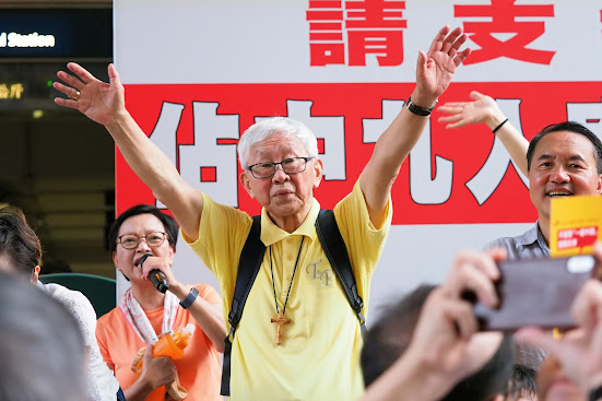 Image of Cardinal Zen with his hands raised used in the article about Cardinal Jospeh Zen being unjustly arrested and sharing his faith online.
