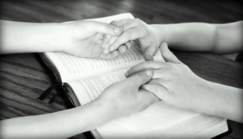 holding hands, bible, praying-752878.jpg