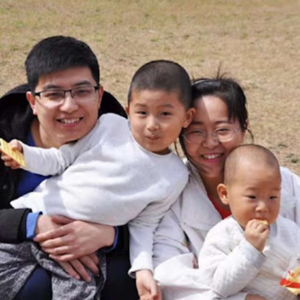 Two Chinese Christians, Li Shanshan and Lie Jie, with their two children