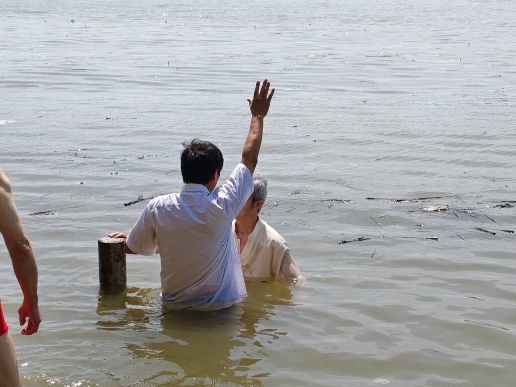 Pastor John Cao performs baptisms in October 2024 (Credit: ChinaAid source).