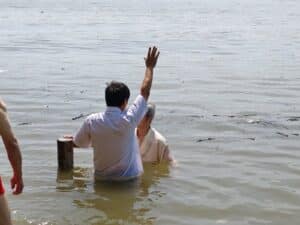 Pastor John Cao performs baptisms in October 2024 (Credit: ChinaAid source).