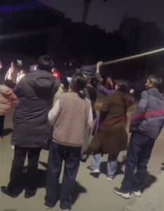 In the evening after the trial concluded, church members watched as Wan Changchun, Xue Shaoqiang, Cao Binting, and Wan Chunqin were taken away in police vehicles