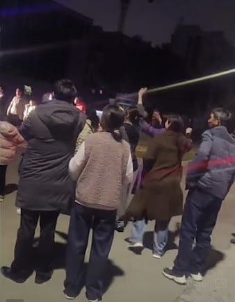In the evening after the trial concluded, church members watched as Wan Changchun, Xue Shaoqiang, Cao Binting, and Wan Chunqin were taken away in police vehicles