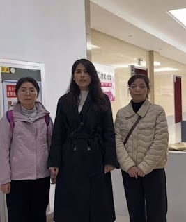 The three wives communicating with court staff